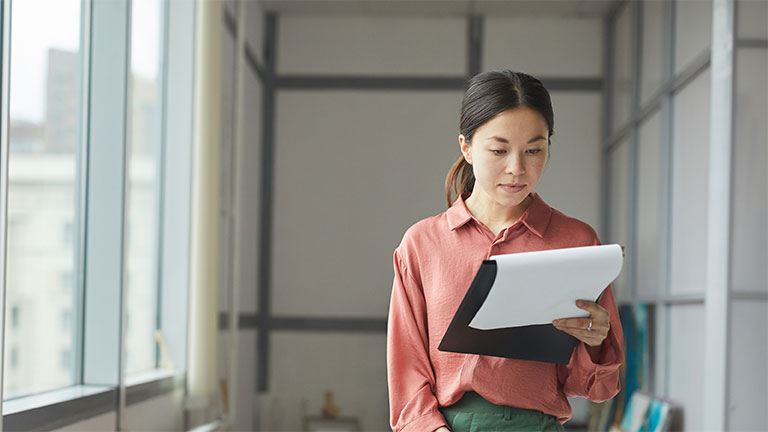 How does outsourced payroll ensure compliance with tax regulations and laws?